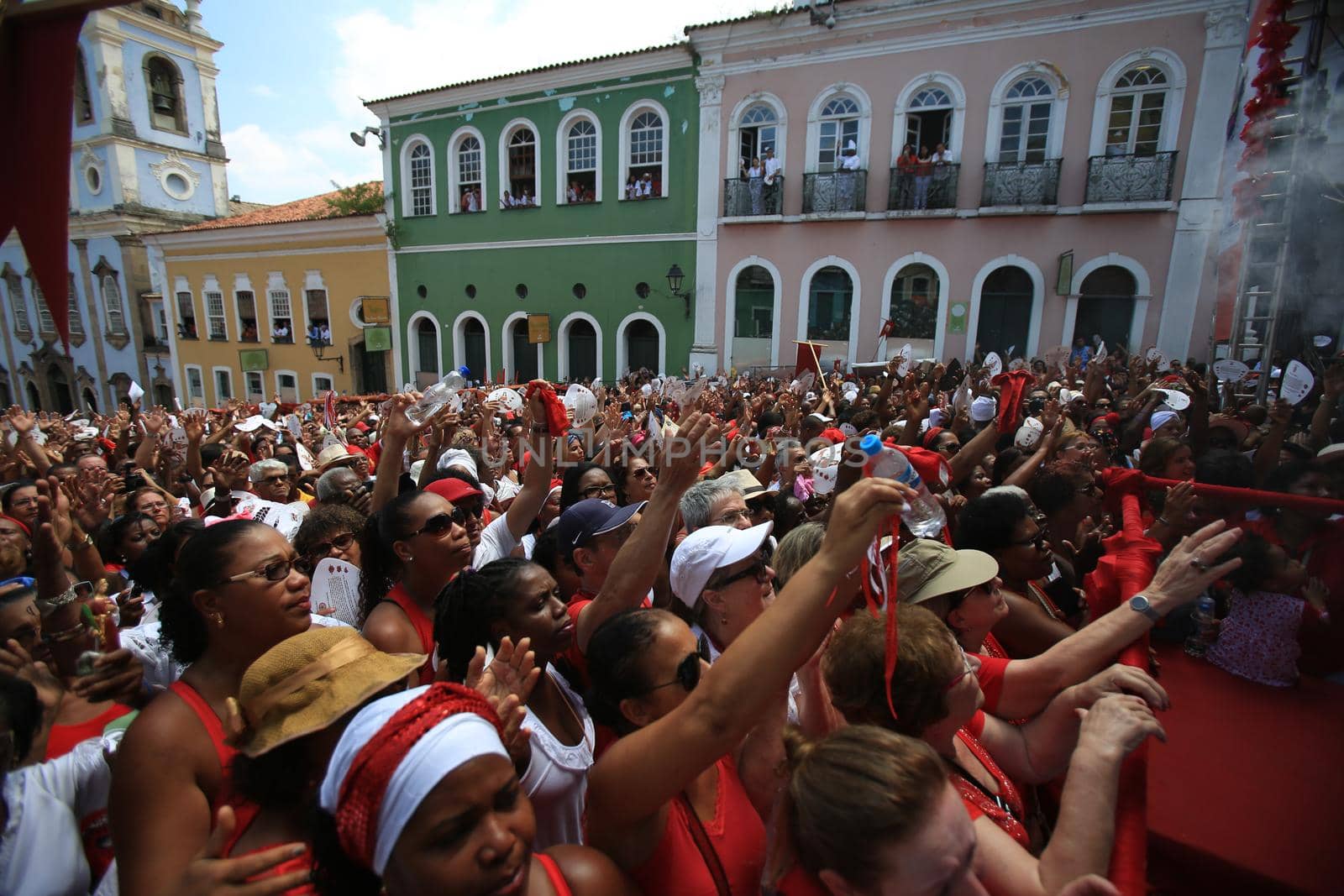 salvador, bahia, brazil - december 4, 2015: hands raised during mass in honor of Santa Barbara in Pelourinho, historic center of the city of Salvador.
