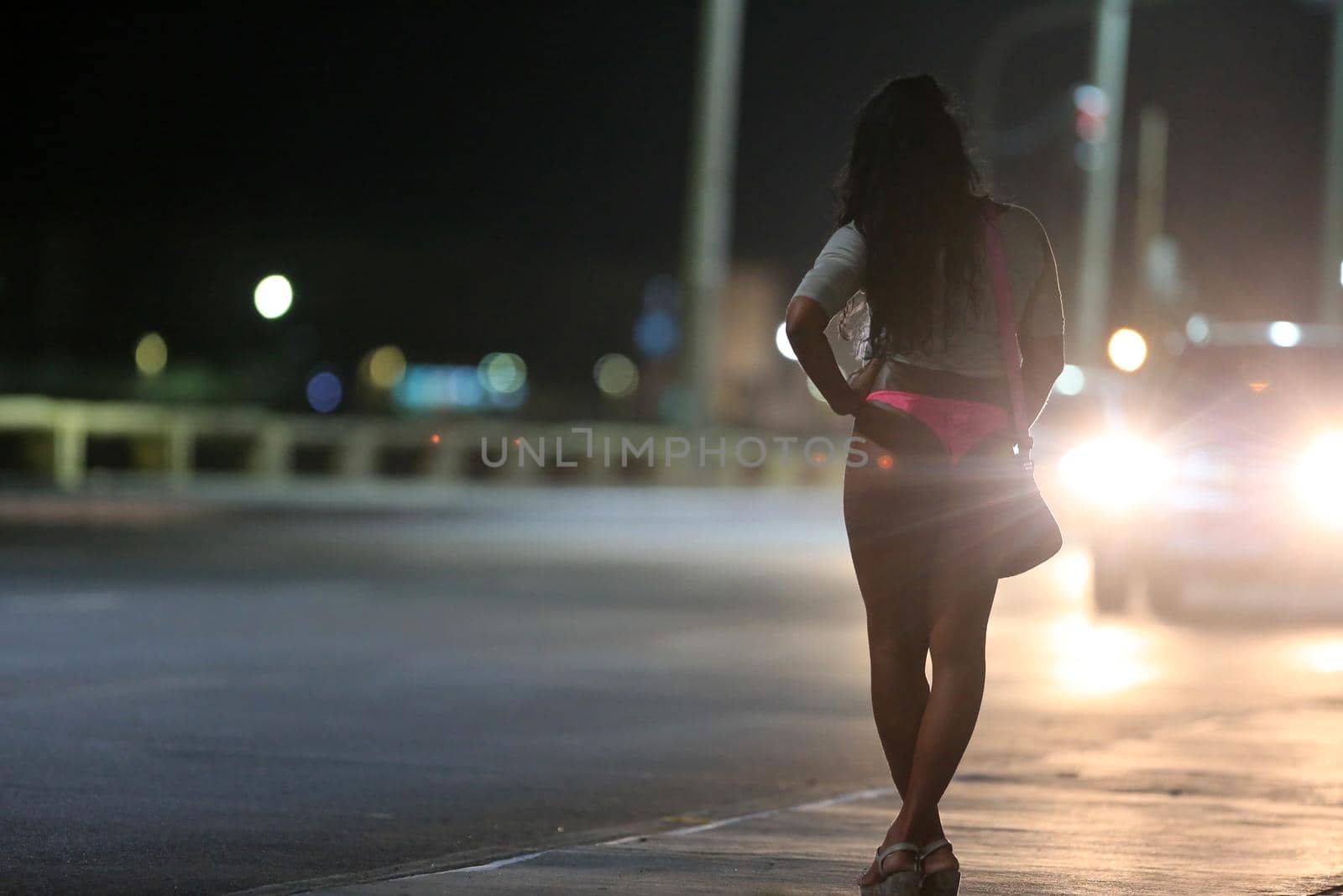 salvador, bahia / brazil - october 5, 2015: a transvestite who acts as a prostitute is seen on the street in the Pituba neighborhood in the city of Salvador.
