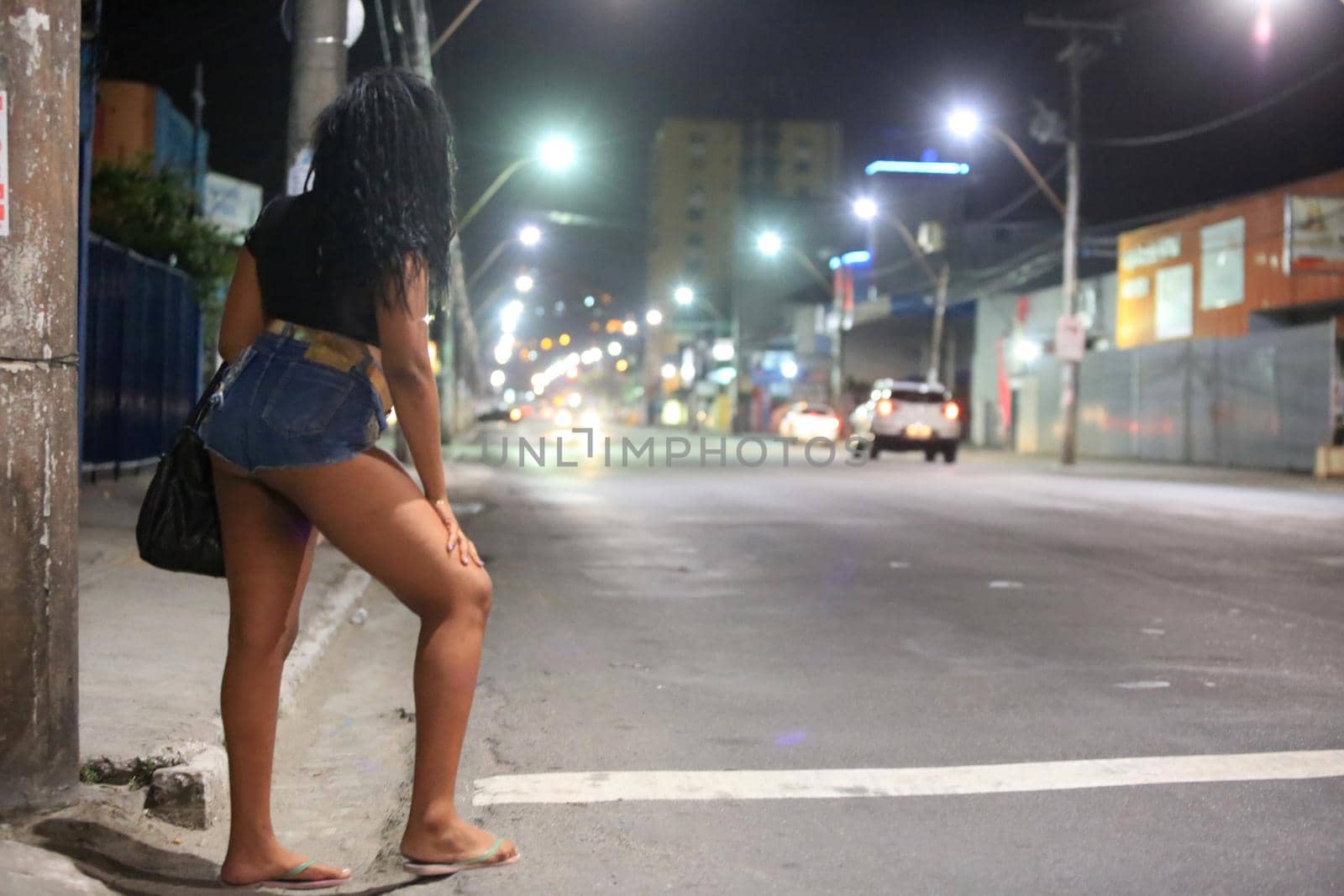 salvador, bahia, brazil - october 4, 2015: transvestite is seen working as a prostitute on a street in the city of Salvador.