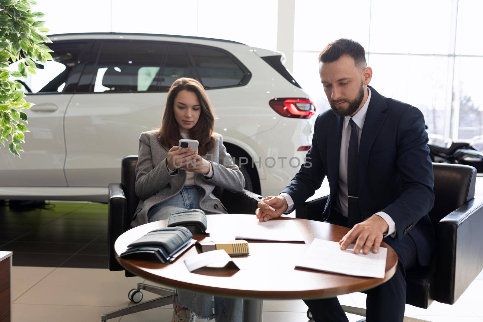 process of buying a new car in a car dealership by TRMK