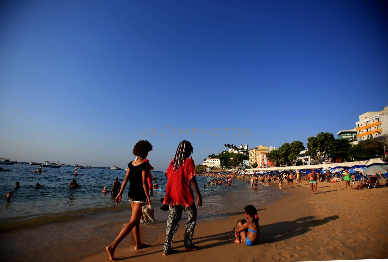 salvador, bahia / brazil - december 5, 2015: people are seen on Porto da Barra beach in the city of Salvador.

