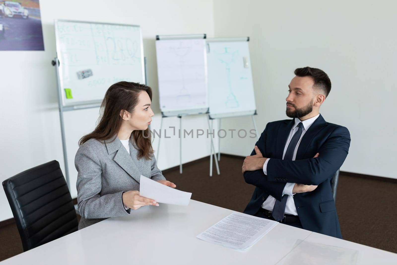 meeting in the meeting room of two company employees in business suits, concept of successful business negotiations by TRMK