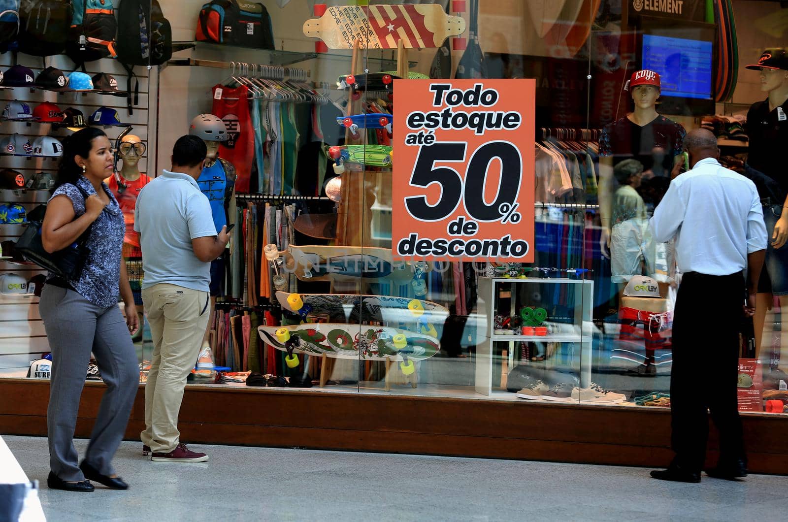 salvador, bahia / brazil - october 21, 2015: poster announcing a 50% discount in a store window in the city of Salvador.
