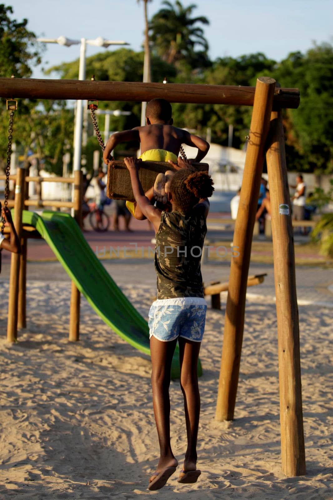 salvador, bahia / brazil - december 1, 2015: Children are seen playing on a playground in the Sao Tome de Paripe neighborhood in the city of Salvador.