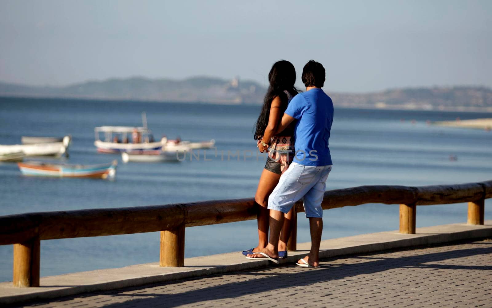 salvador, bahia / brazil - december 2, 2015: couple is seen on Avenida Beira Mar in the Ribeira neighborhood in the city of Salvador.
