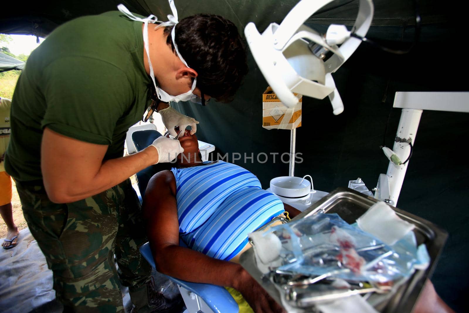 salvador, bahia / brazil - november 4, 2015: dentist from the navy of Brazil is seen during social action on Ilha de Mare in the city of Salvador.




