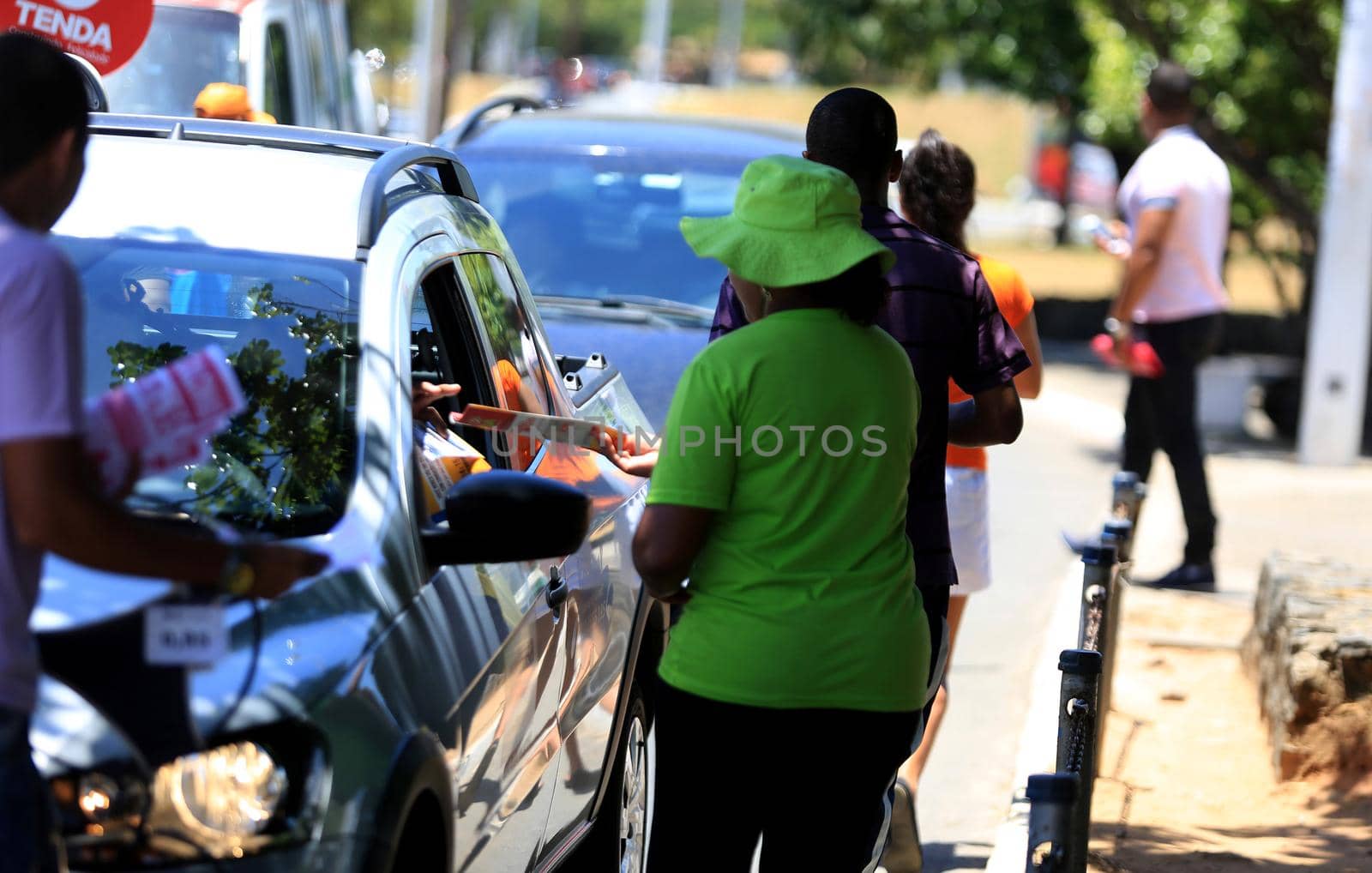 salvador, bahia / brazil - november 12, 2015: person is seen distributing advertising leaflets facing the city of Salvador. The practice is known as leafleting.