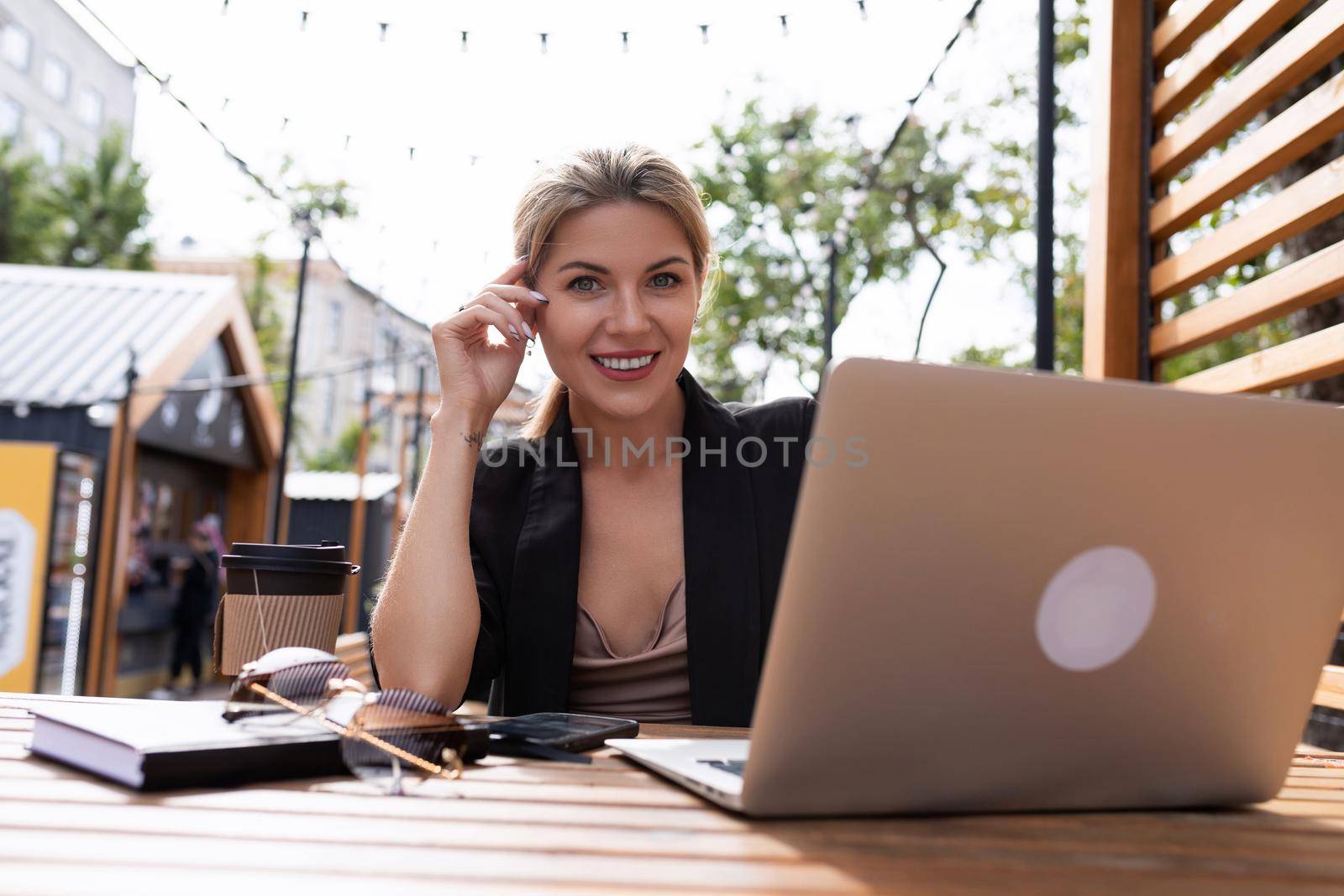 portrait of young businesswoman earn money with laptop outdoors.