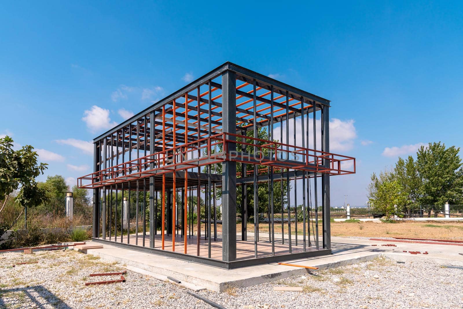 Metal frame of newly built building. Construction of a new tiny house by Sonat