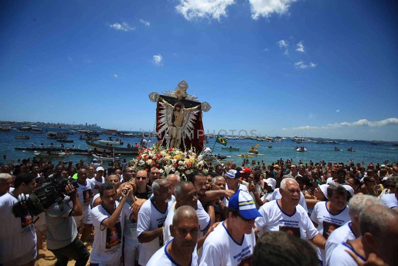 salvador, bahia, brazil - january 1, 2016: image of Bom Jesus dos Navegantes being carried by devotees on Boa Viagem beach after crossing the sea at Baia de Todos os Santos in Salvador.