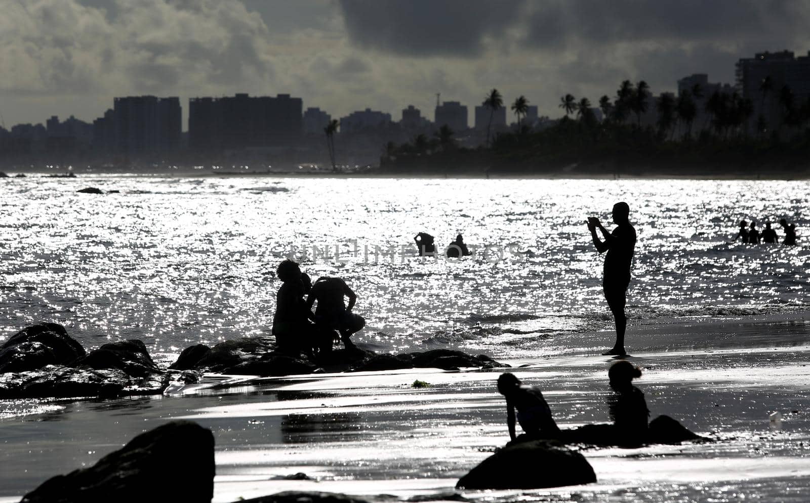 salvador, bahia / brazil - september 6, 2015: People are seen on rocks of Itapua Beach in Salvador.
