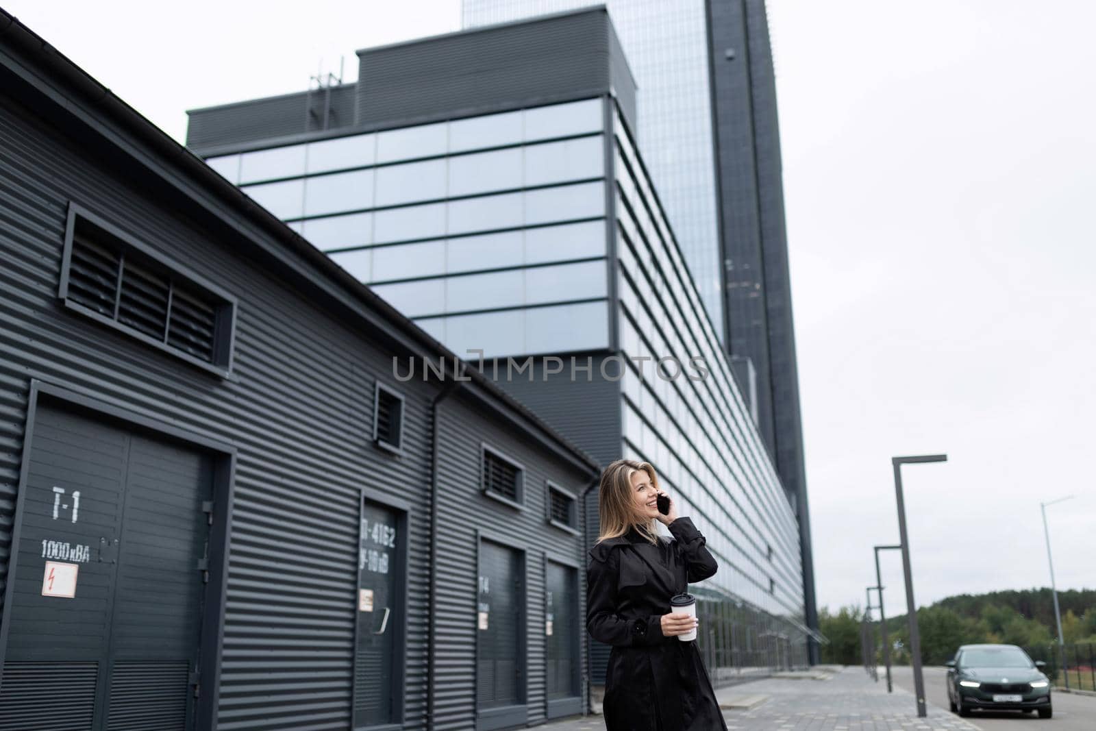 successful business woman hurries to do business next to the office building.