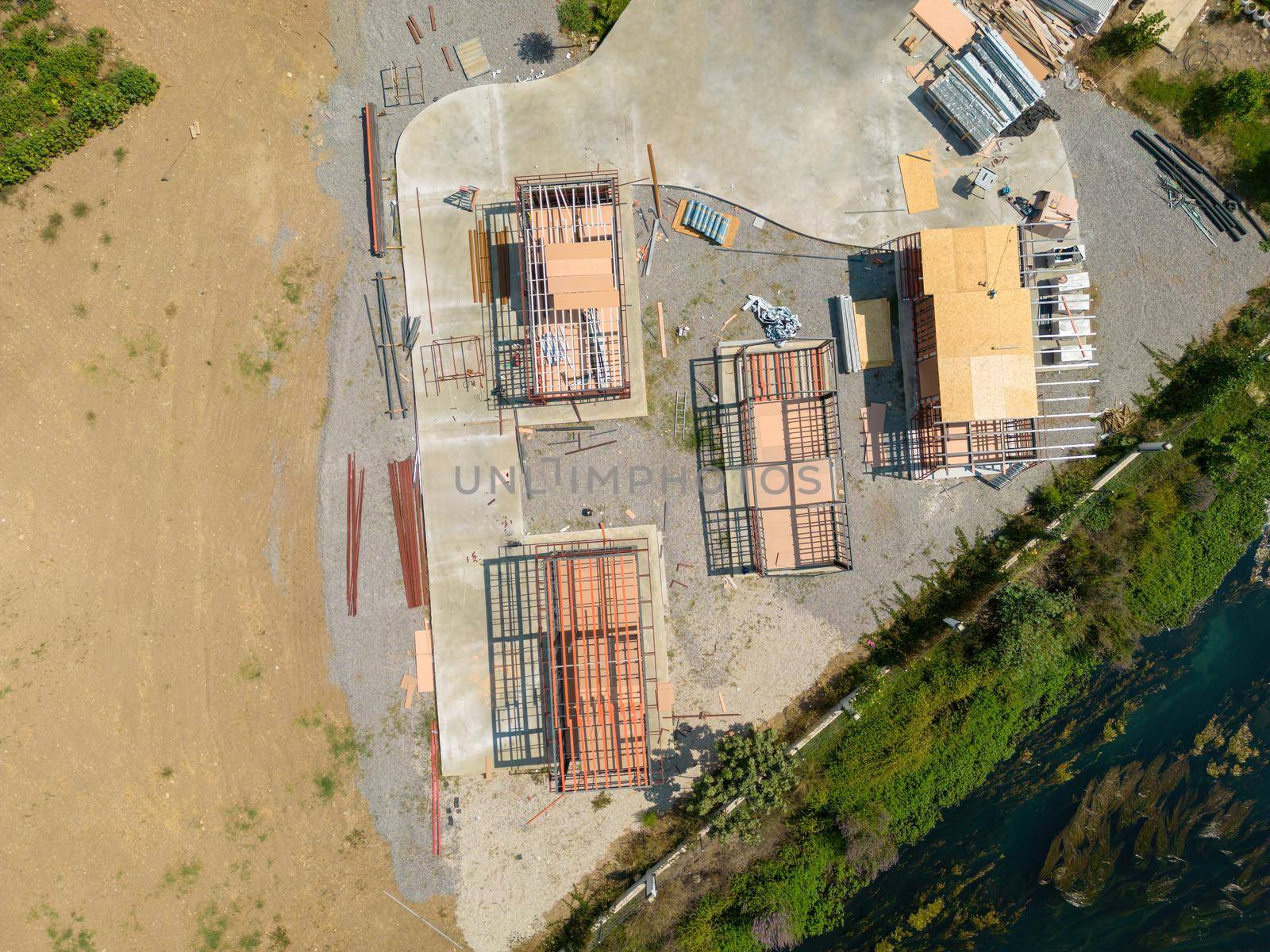 Aerial photo top to down view of tiny houses built with metal profile