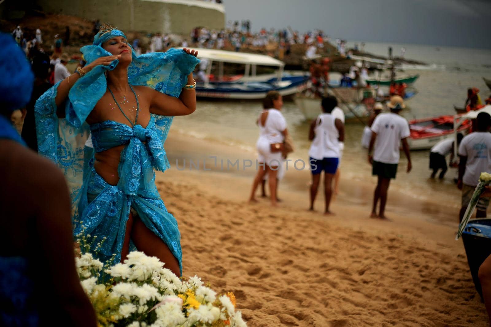 salvador, bahia / brazil - february 2, 2020: devotees and admirers of the orixa yemanja, a candomble entity, seen on the rio Vermelho beach, in the city of salvador, during a religious celebration.
