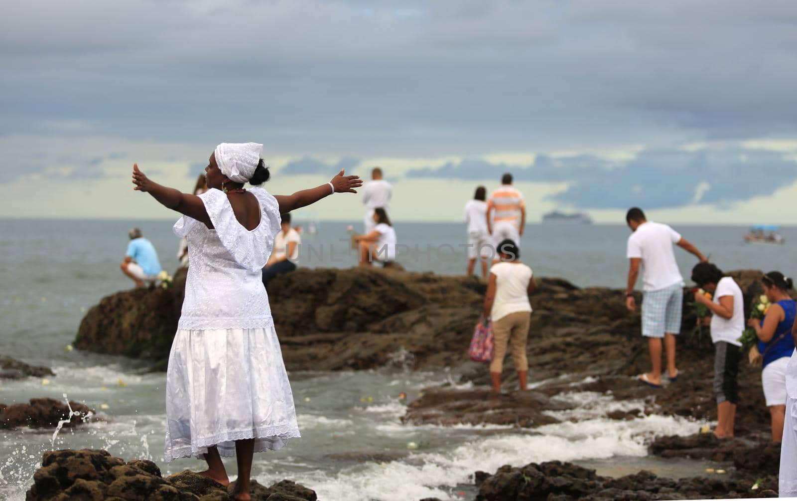 salvador, bahia / brazil - february 2, 2016: Candomble supporters and supporters greet the Yemanja orixa during a festan on the Rio Vermelho neighborhood beach in Salvador. 