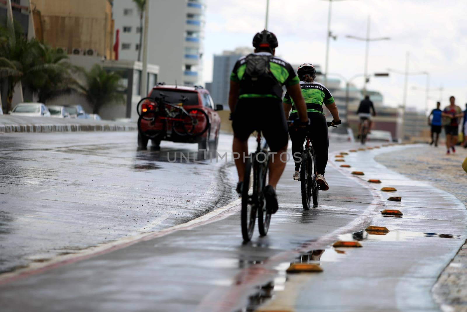 salvador, bahia, brazil - august 7, 2016: person riding a bicycle on a bike path in the city of Salvador.