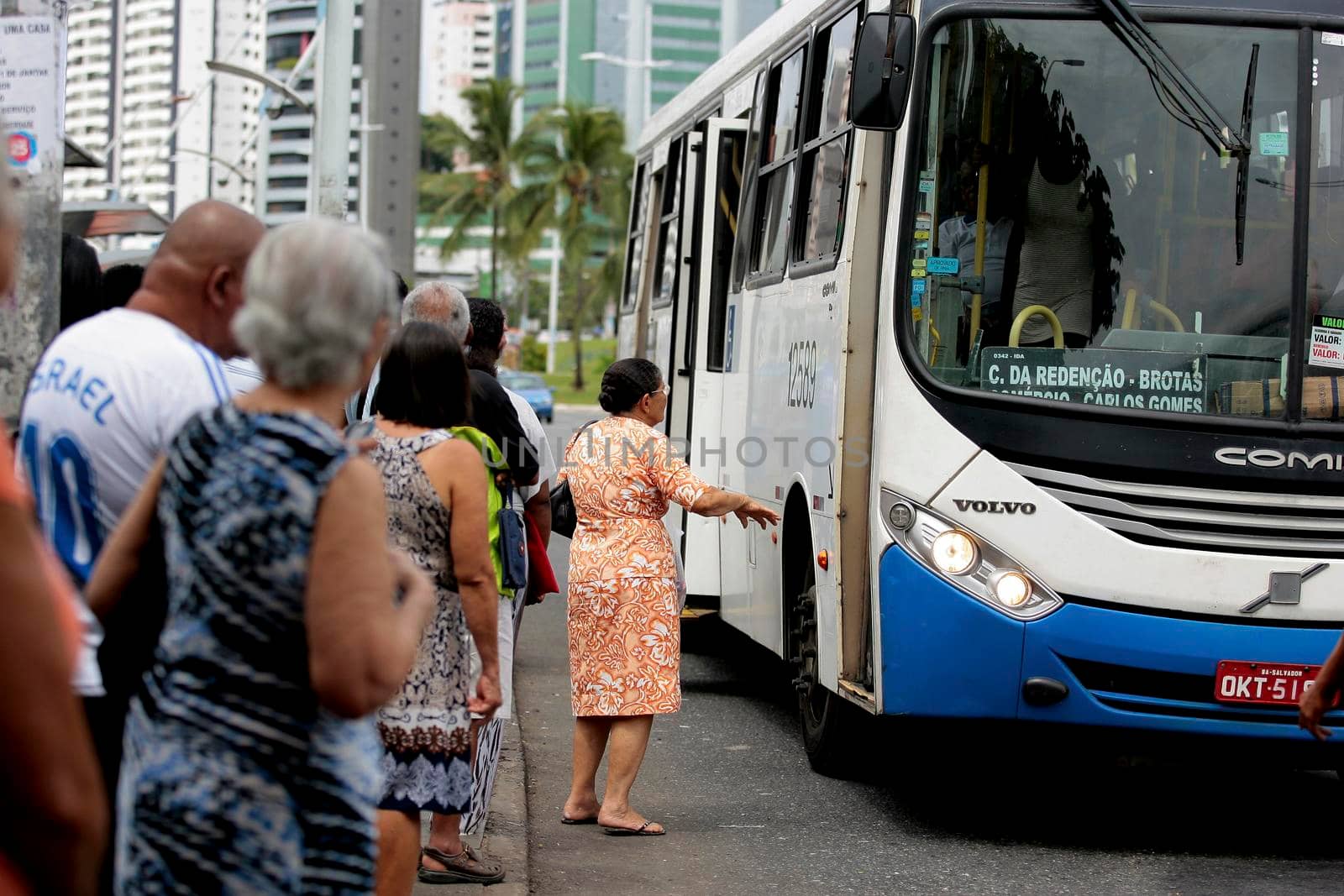 salvador, bahia / brazil - september 22, 2016: Senior citizen is seen waiting for public transportation bus from Salvador city.