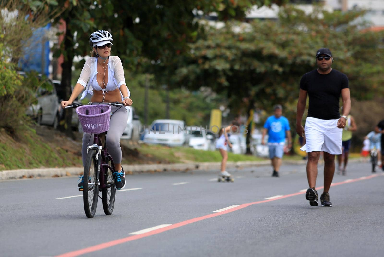 salvador, bahia, brazil - august 7, 2016: person riding a bicycle on a bike path in the city of Salvador.