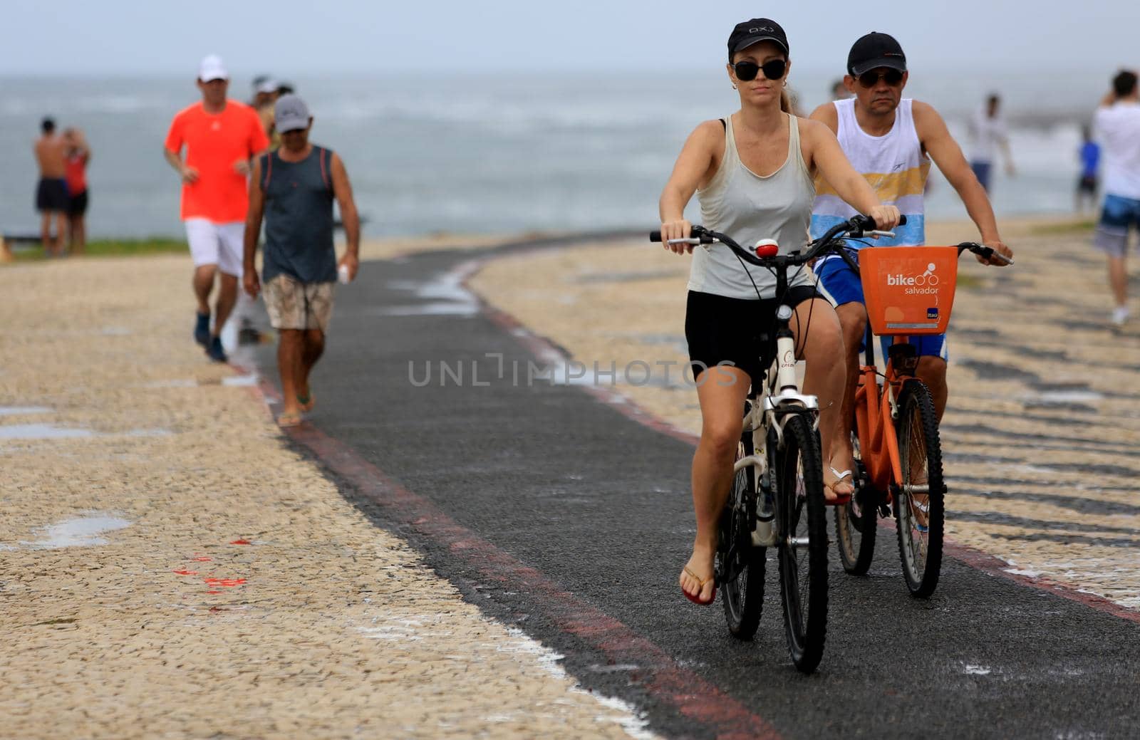 salvador, bahia / brazil - august 7, 2016: Cyclist is seen on bike lane in the Jardim de Alah, Waterfront Salvador. The bicycle is mainly used for commuting to work.
