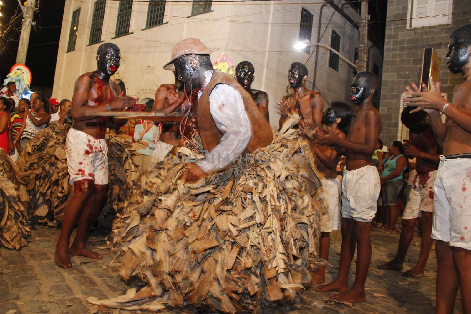 santo amaro, bahia, brazil - january 25, 2013: young people make the enactment of nego fugido, a cultural event that simulates escaped slaves from captivity in the city of Santo Amaro.