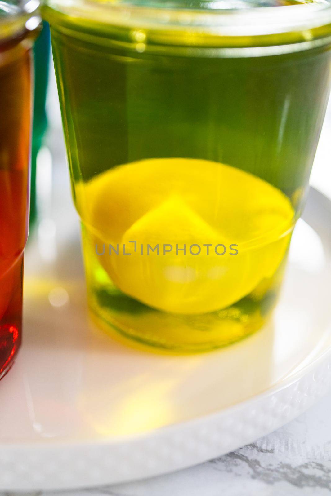 Coloring hard-boiled white eggs with natural food coloring.
