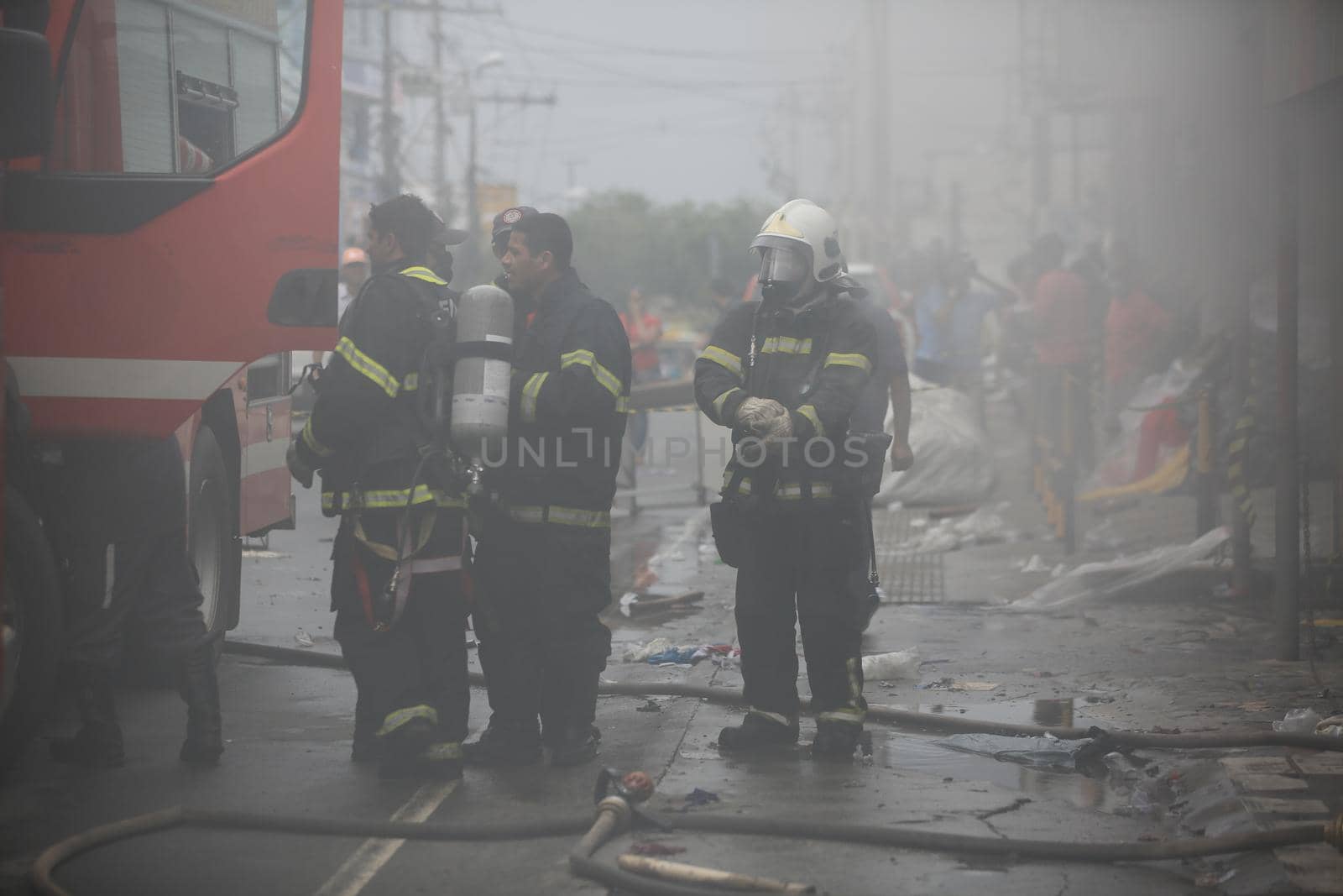 salvador, bahia, brazil - july 20, 2017: Members of the Fire Department firefighting the mattress factory in the city of Salvador.