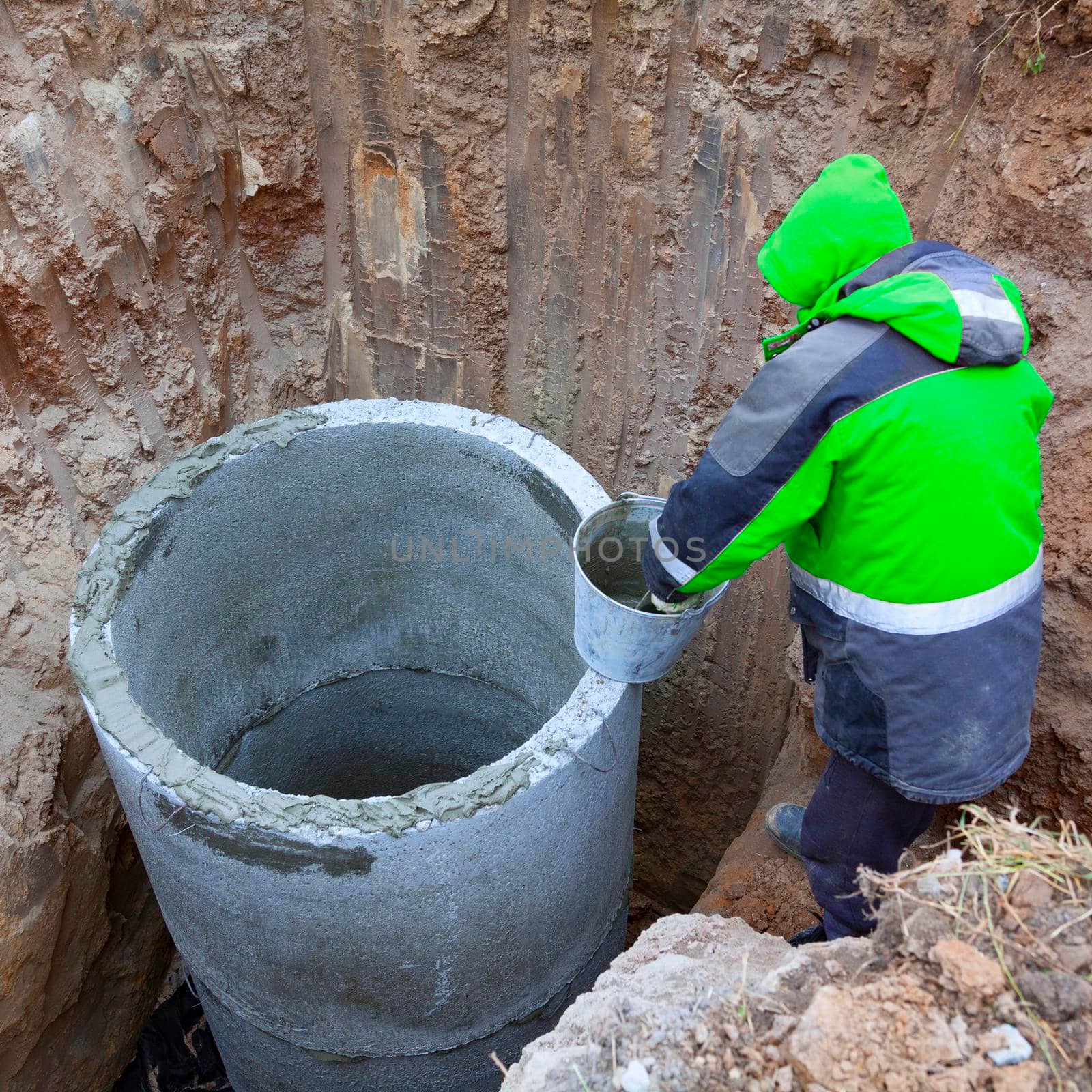 Installation of underground tank for sewage system.