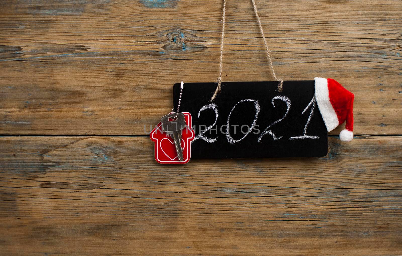 2021 - chalkboard with outlined text with red Santa hat - on wood