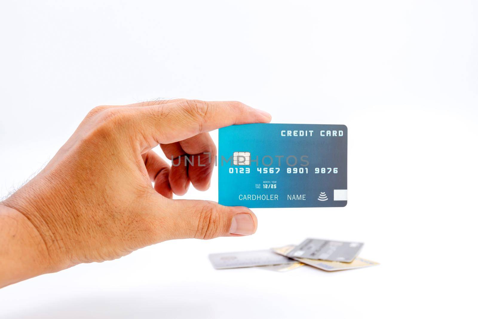 Hand holding bank credit cards on white background. by wattanaphob