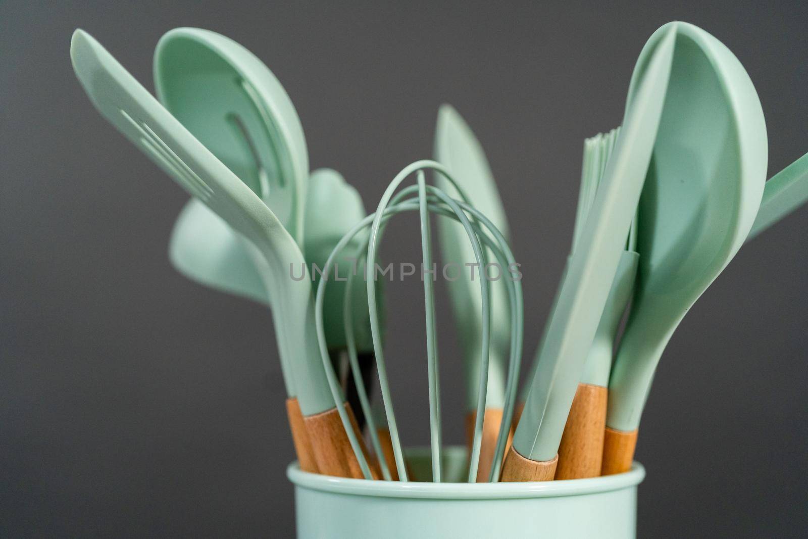Silicone cooking utensils with wooden handle.