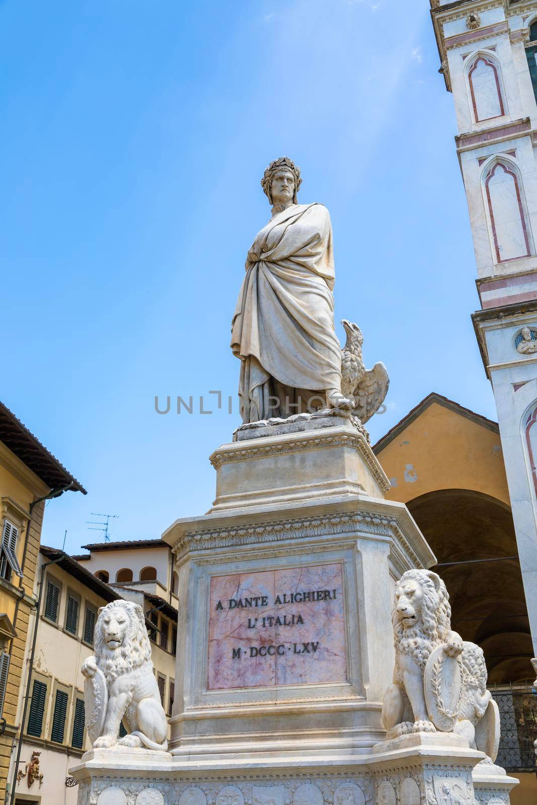 Dante Alighieri statue in Florence, Tuscany region, Italy, with amazing blue sky background. by Perseomedusa