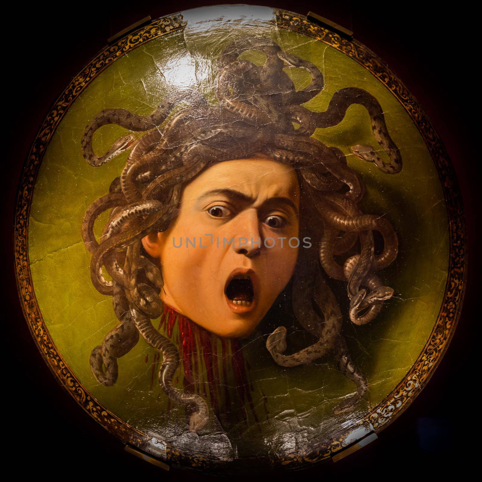 Florence, Italy - Circa August 2021: Medusa by Caravaggio, ca 1598 - oil on canvas