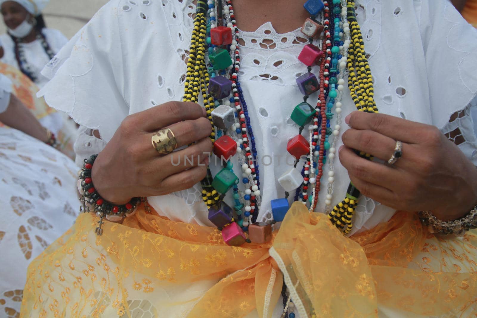 salvador, bahia, brazil - november 21, 2021: Baianas women are seen near Farol da Barra during a protest to approve the Carnival in the city of Salvador.