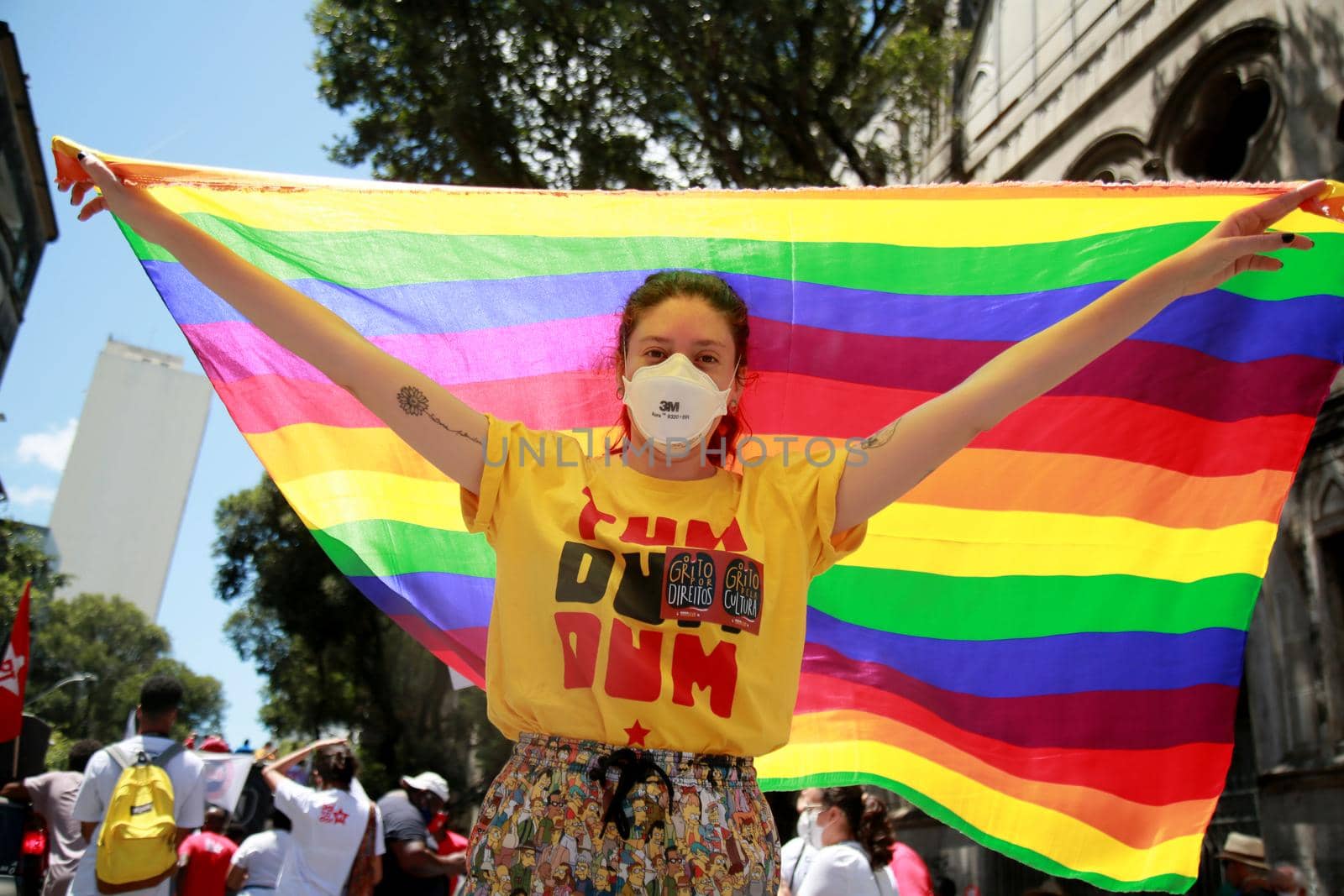 salvador, bahia, brazil - september 7, 2021: demonstrator carries gay pride flag during demonstration in Salvador city.
