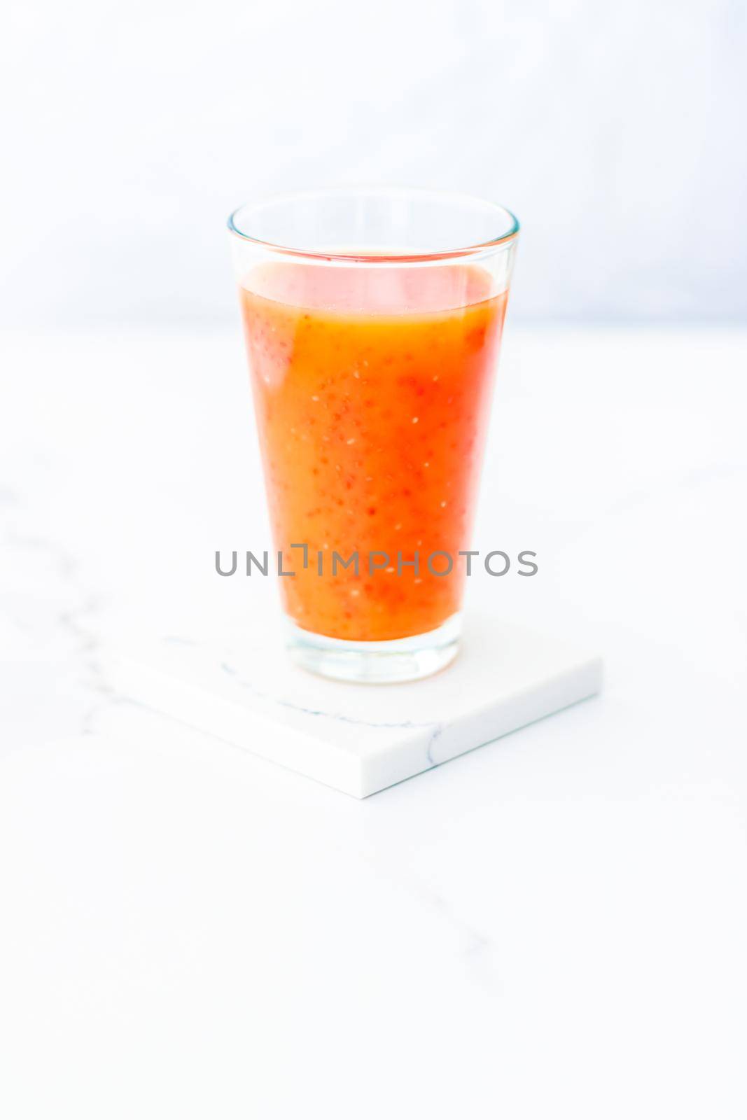 Healthy nutrition, organic drink and fasting cleanse concept - Glass of red fruit smoothie juice with chia seeds for diet detox, perfect breakfast recipe
