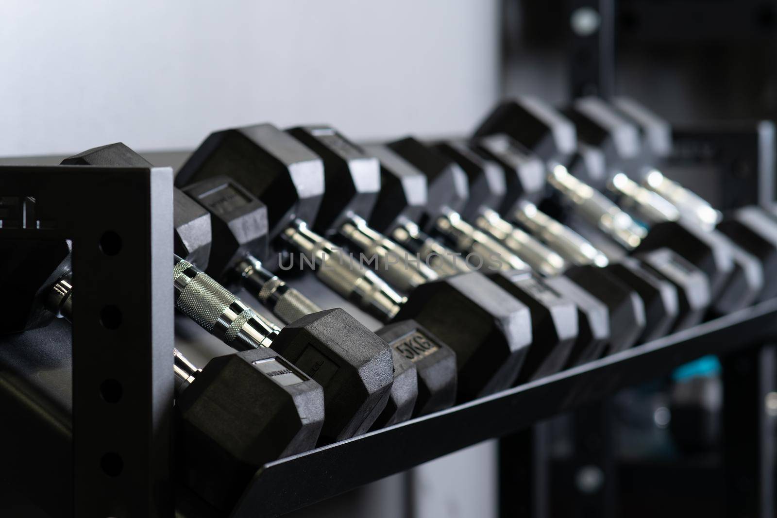 Dumbbell home gym wall blurry set storage strength equipment, concept studio rag from heavy for exercise hand, weight bodybuilding. ,
