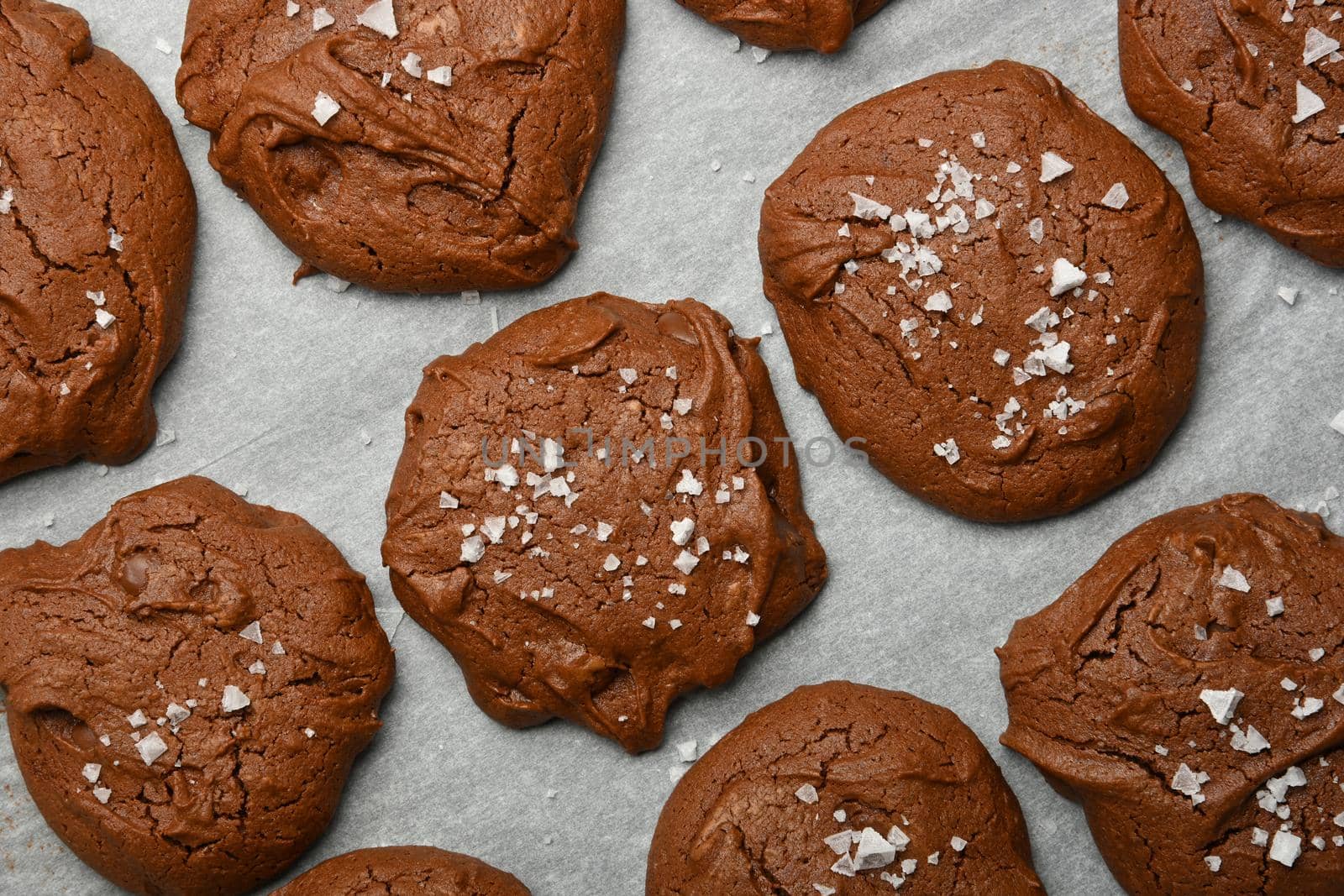 Brownie chocolate cookies on baking paper by BreakingTheWalls
