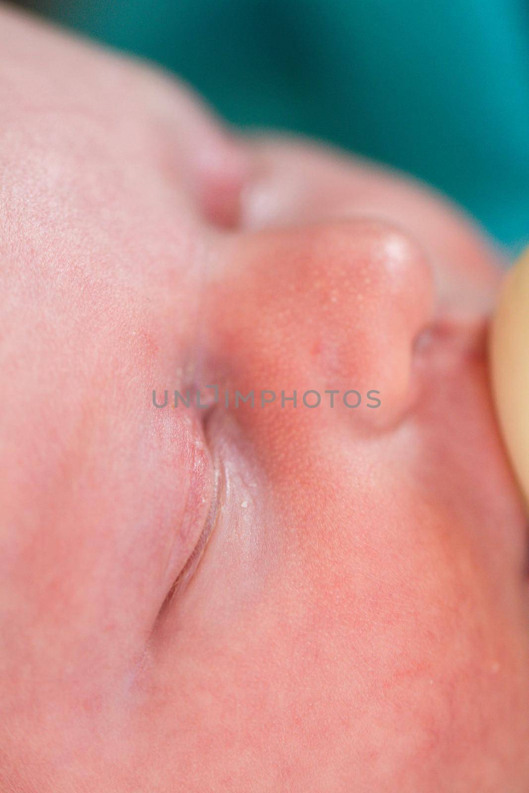 Newborn baby girl at feeding time.