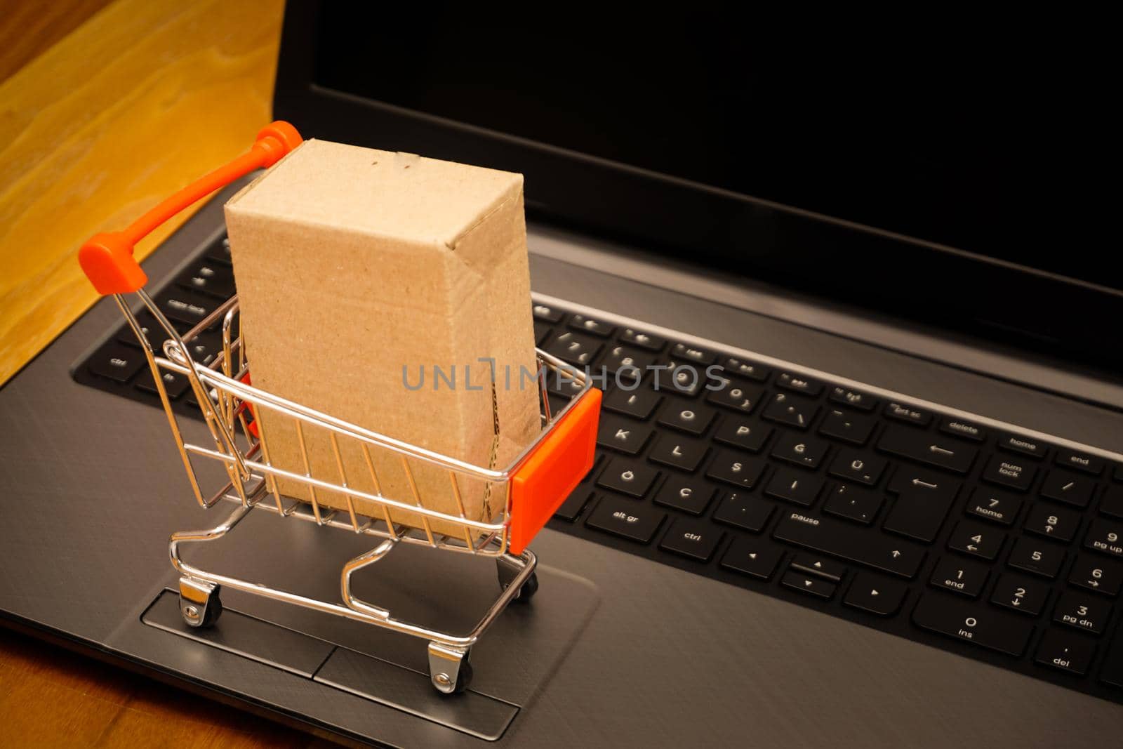 Online shopping illustration concept shot with miniature cart