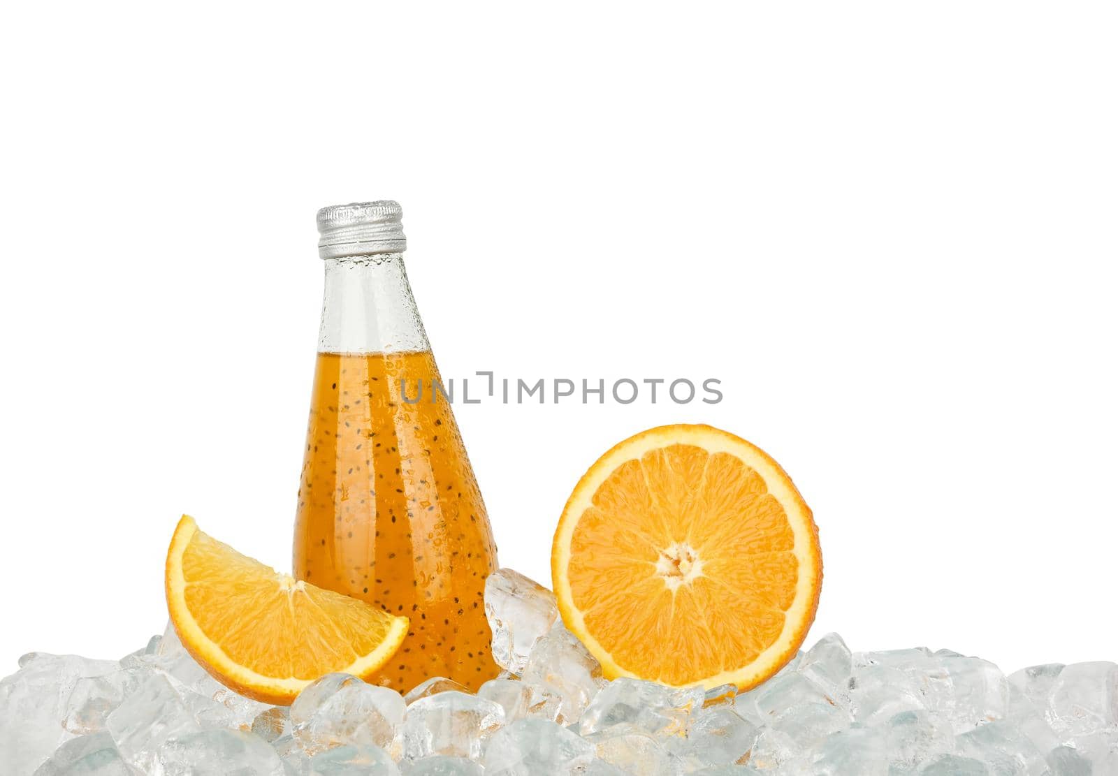 Close up one glass bottle of cold orange juice cocktail drink with chia seeds and half cut orange on ice cubes isolated on white background, low angle side view