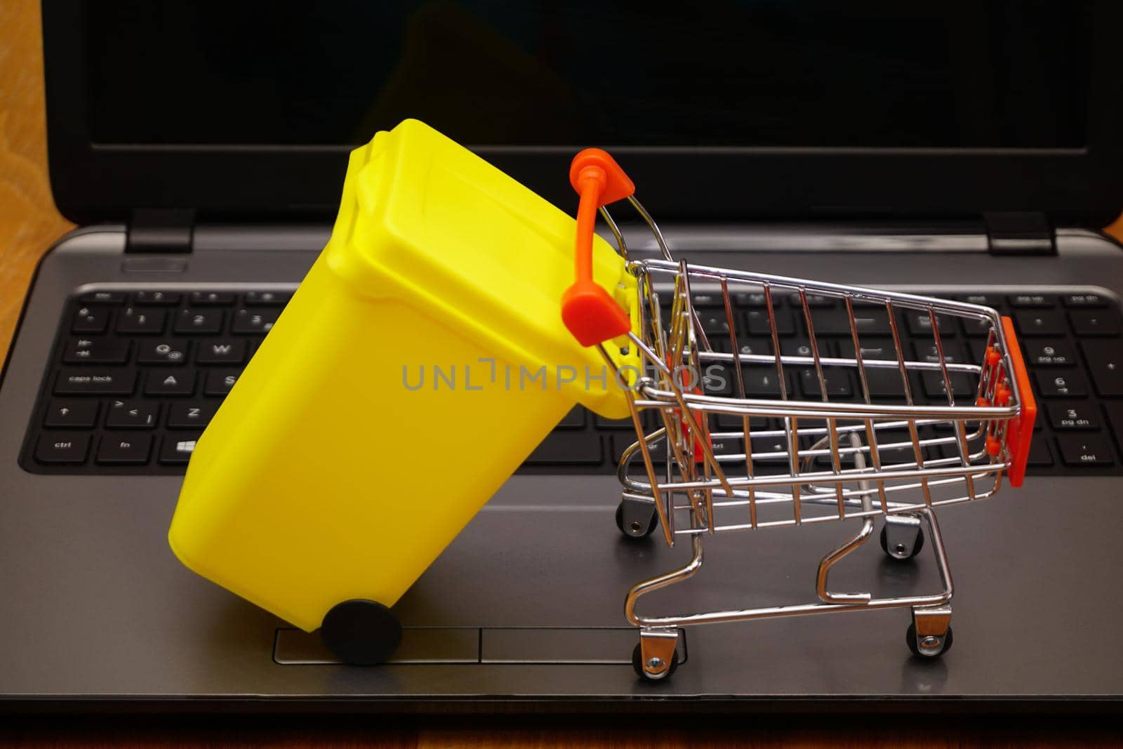 Electronic waste disposal illustration with miniature objects concept shot