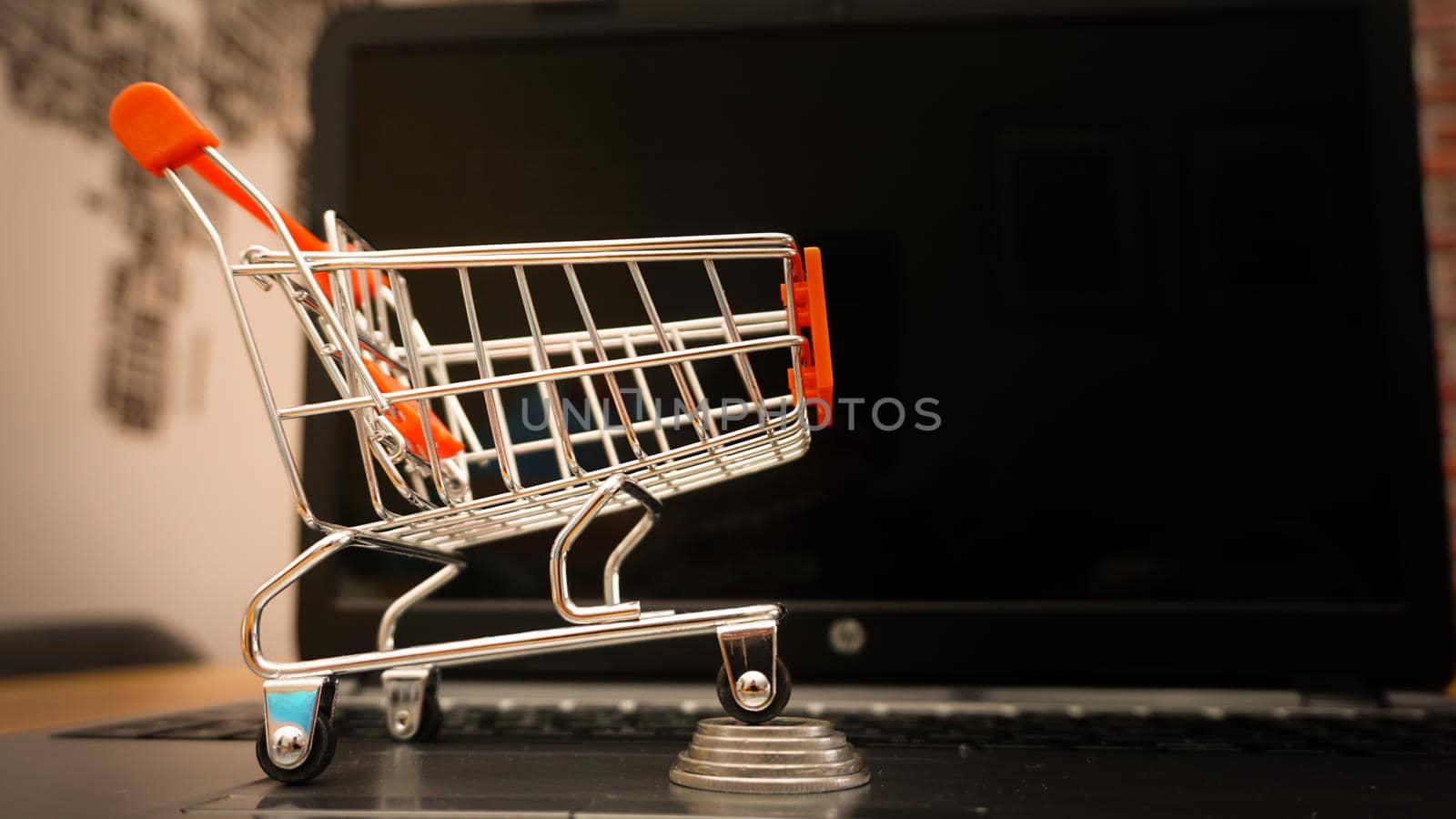 Online shopping illustration concept shot with miniature cart