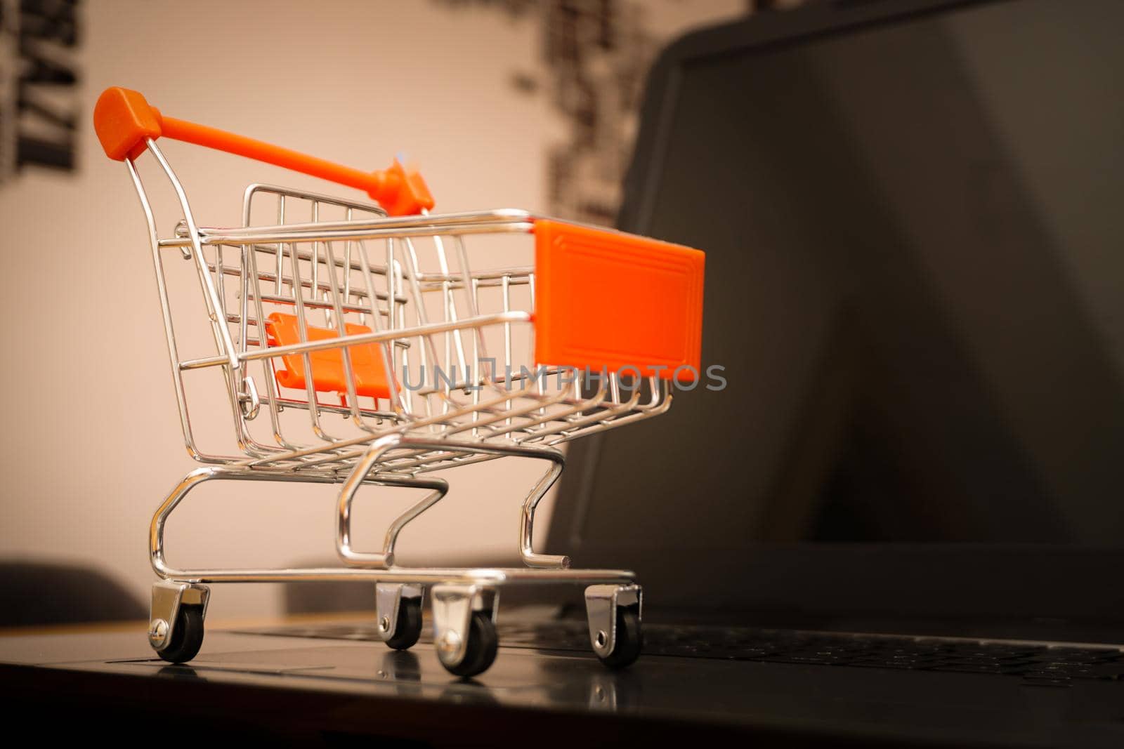 Online shopping illustration concept shot with miniature cart