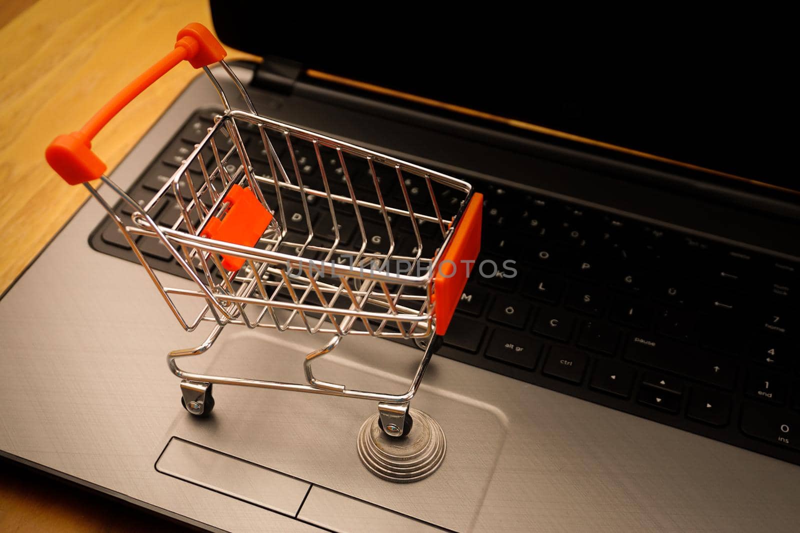 Online shopping illustration concept shot with miniature cart