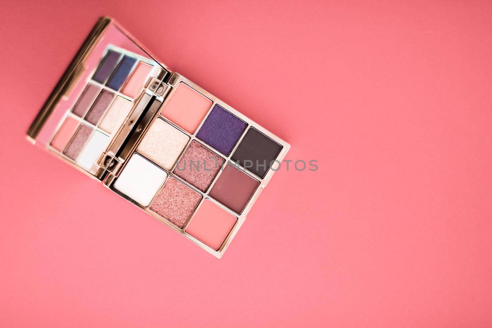 Cosmetic branding, mua and girly concept - Eyeshadow palette and make-up brush on coral background, eye shadows cosmetics product for luxury beauty brand promotion and holiday fashion blog design