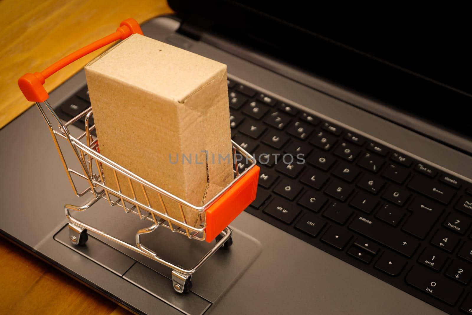 Online shopping illustration concept shot with miniature cart