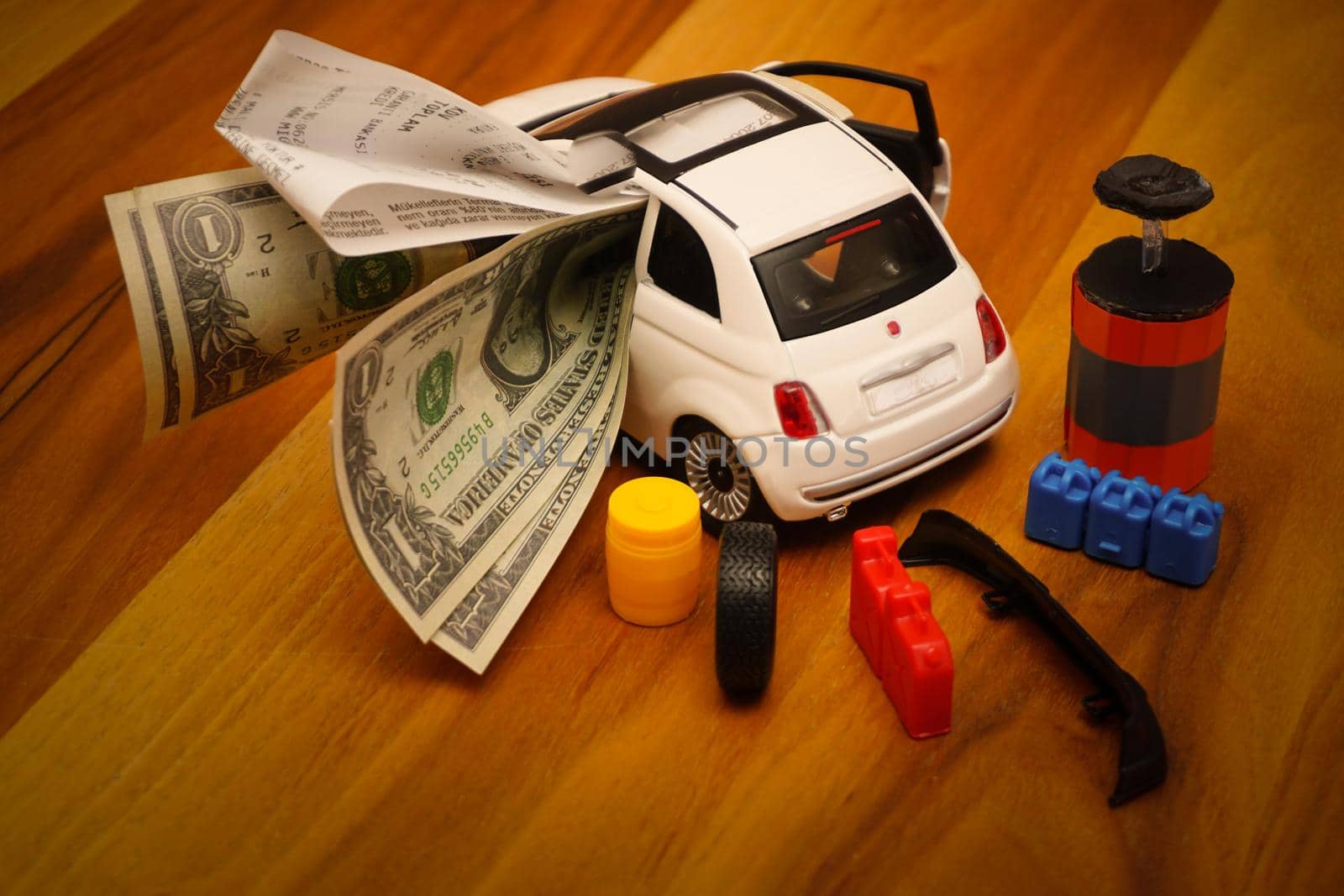 Car expenses illustration with miniature objects