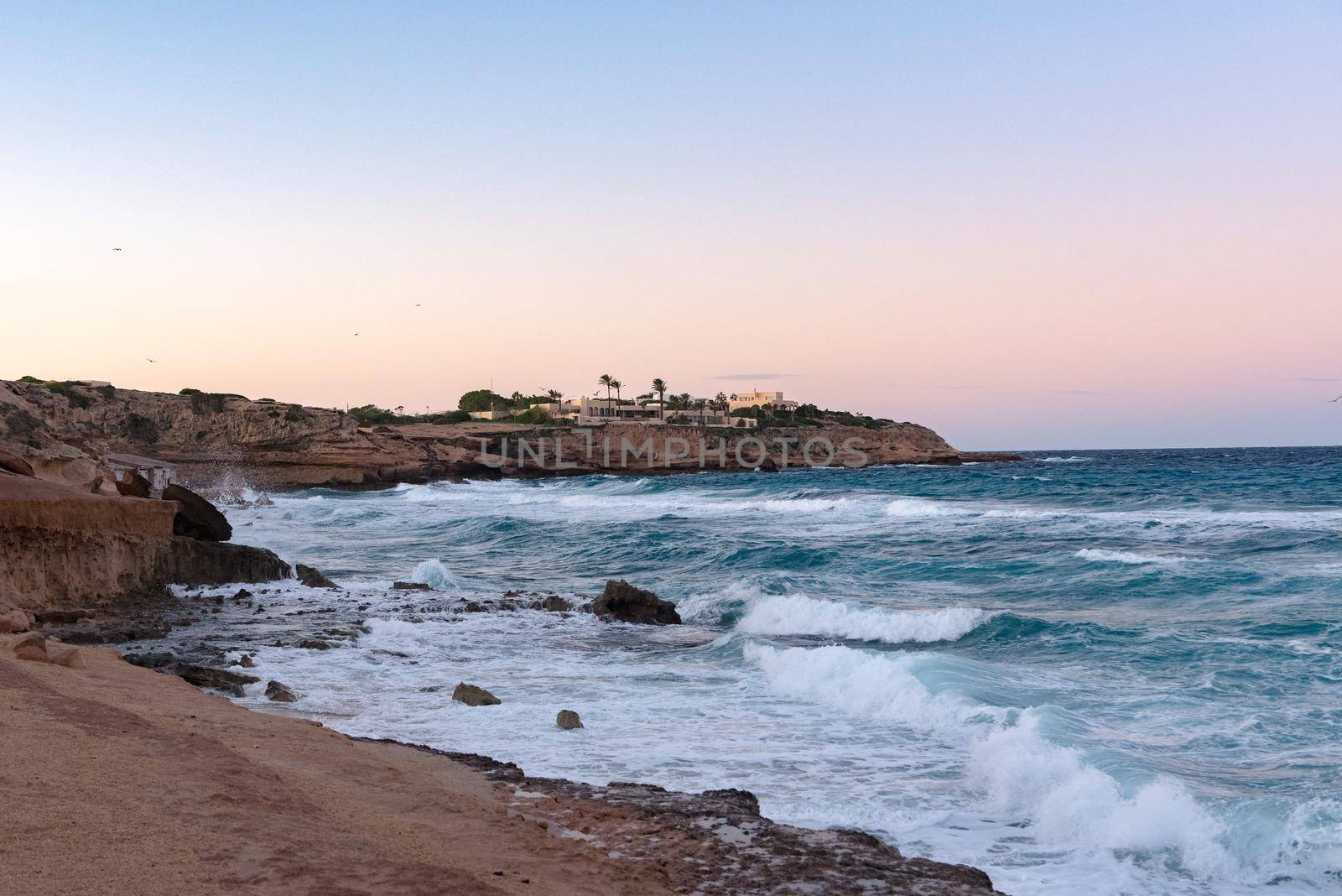 Ibiza sunshine from Cala Conta Comte in San Jose at Balearic Islands Spain.