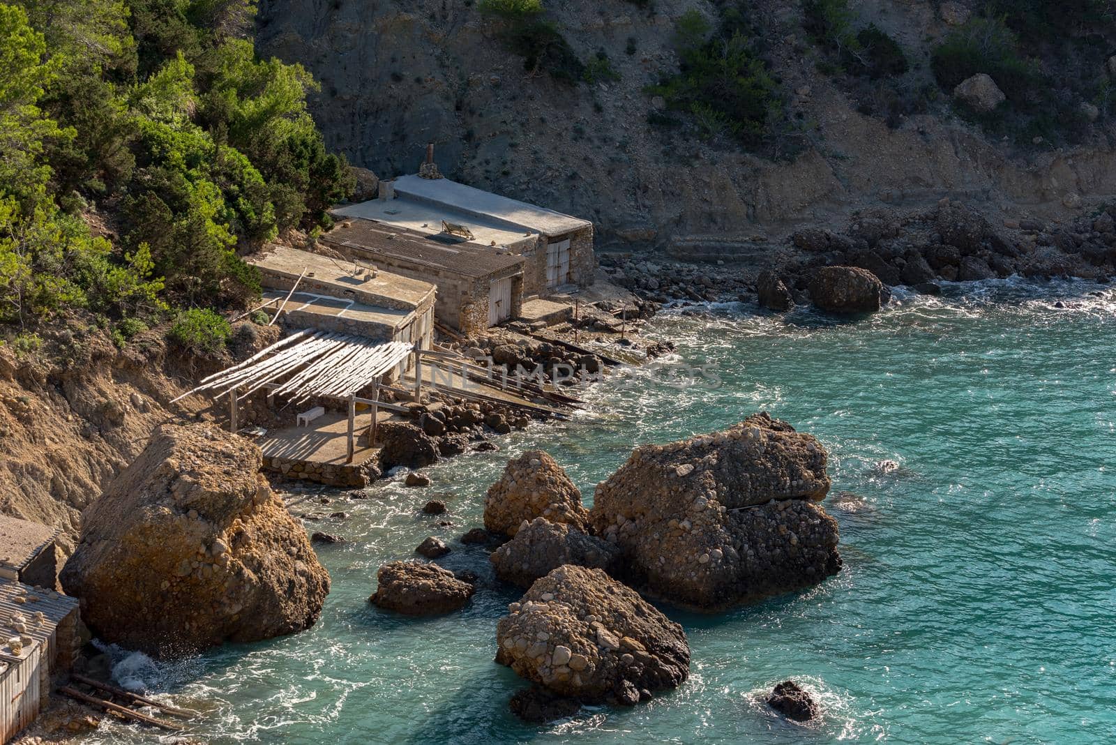 Turquoise waters in Es Portitxol, Ibiza, Spain. Hidden bay on the Island of Ibiza, in Sant Joan de Labritja.