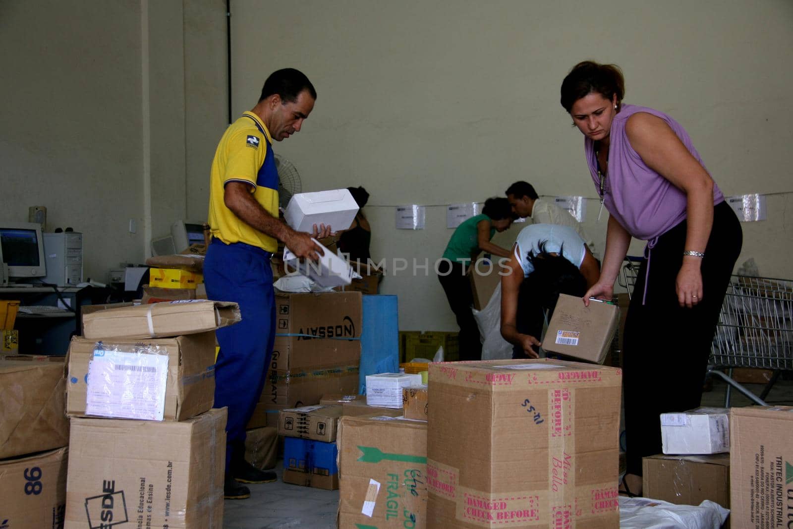 eunapolis, bahia / brazil - april 1, 2008: Correios employees sort orders for delivery in the city of Eunapolis, in southern Bahia.